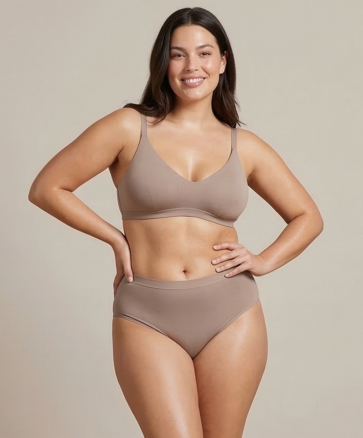 Model in casual beige lingerie set, smiling.