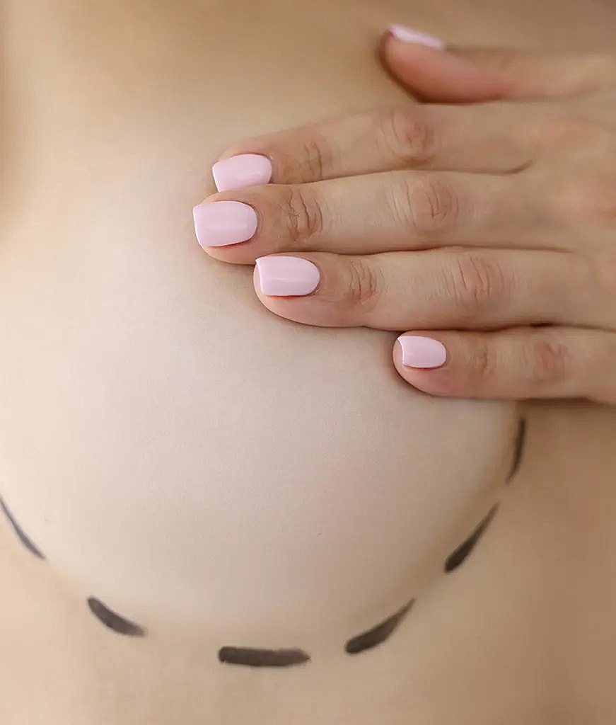 Hand resting on a softly contoured surface.