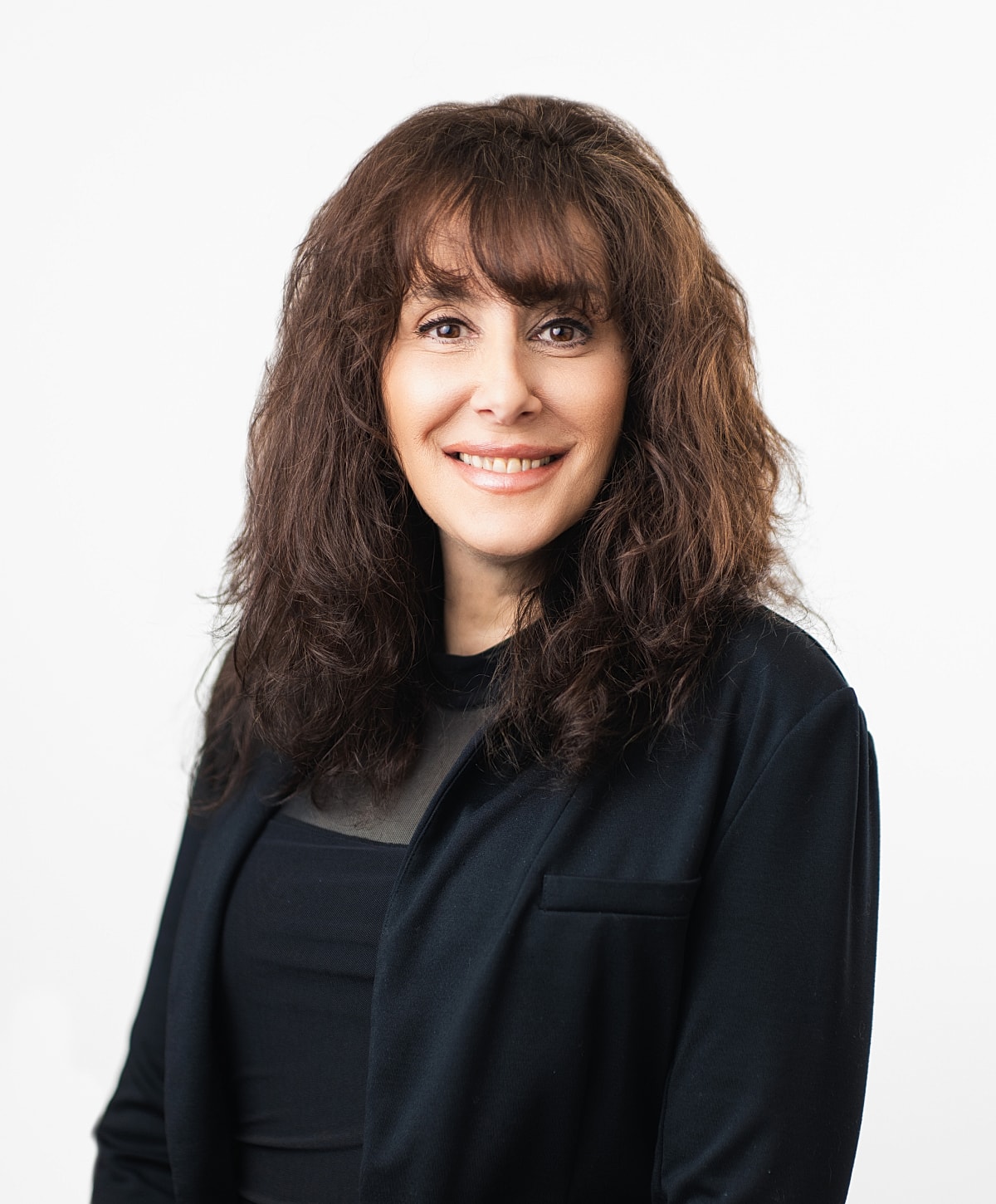 Professional portrait of a woman smiling.