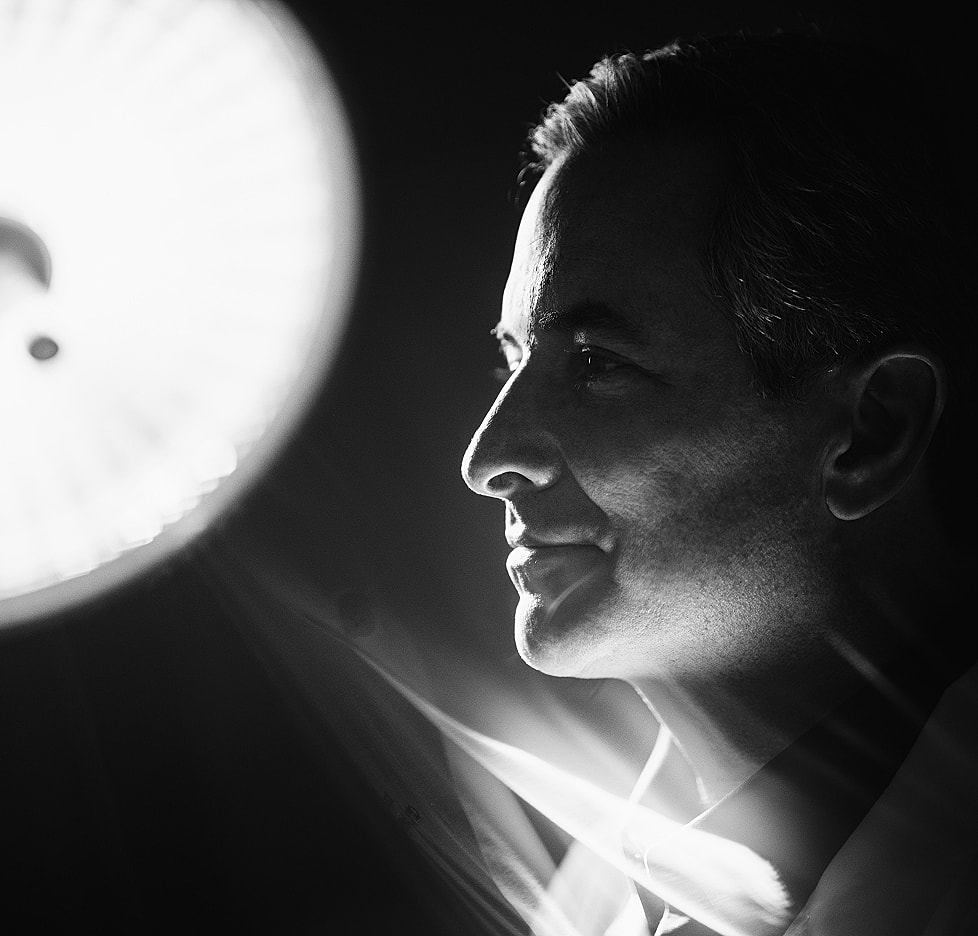 Black and white portrait with dramatic lighting.