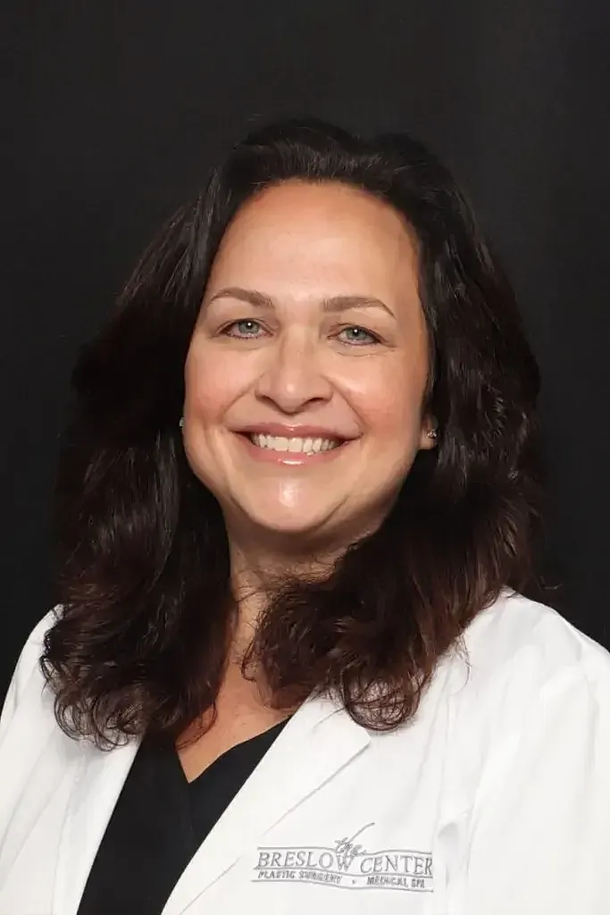 Smiling professional in a medical coat.