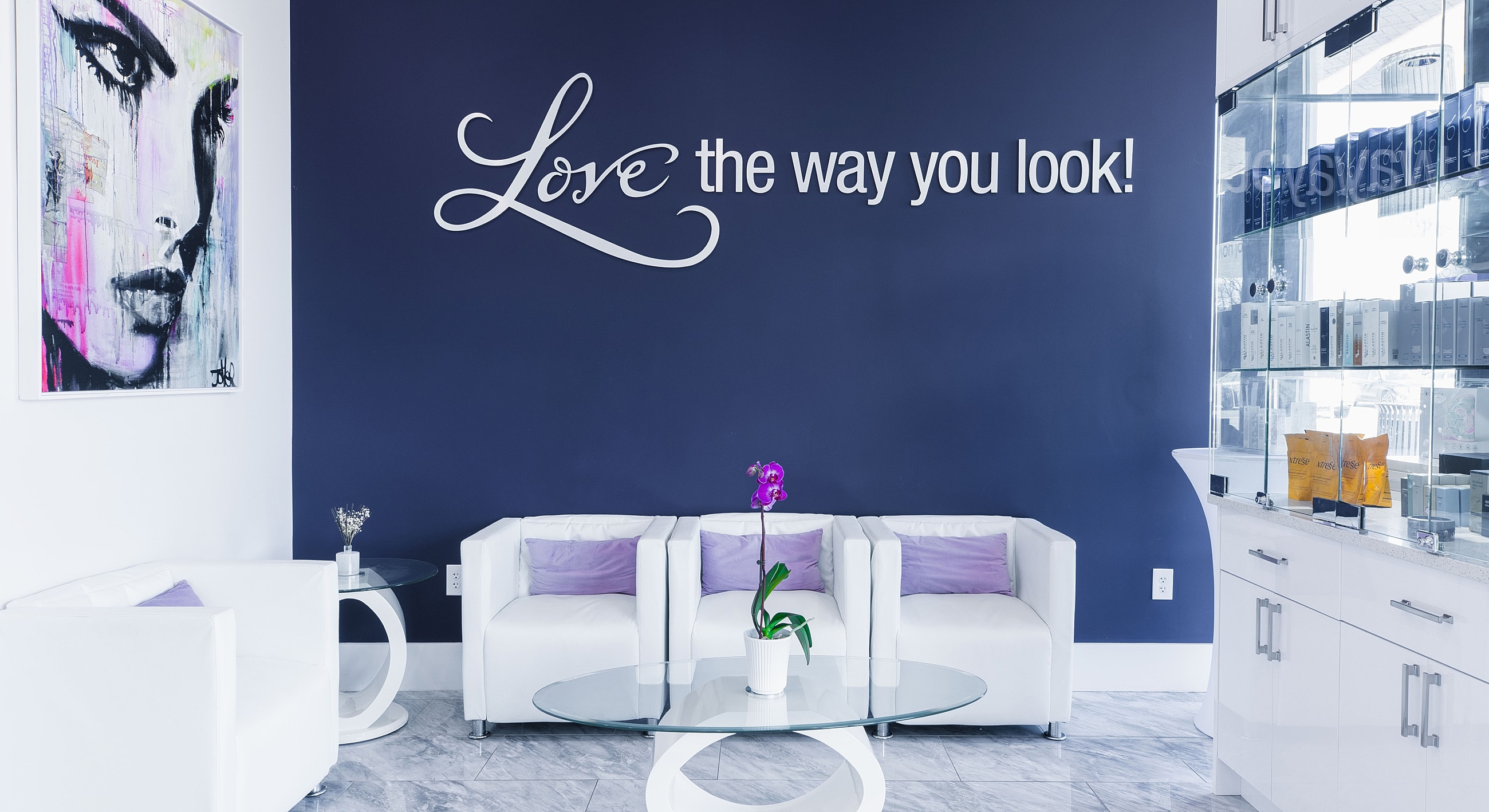 Stylish salon with inspirational wall art.